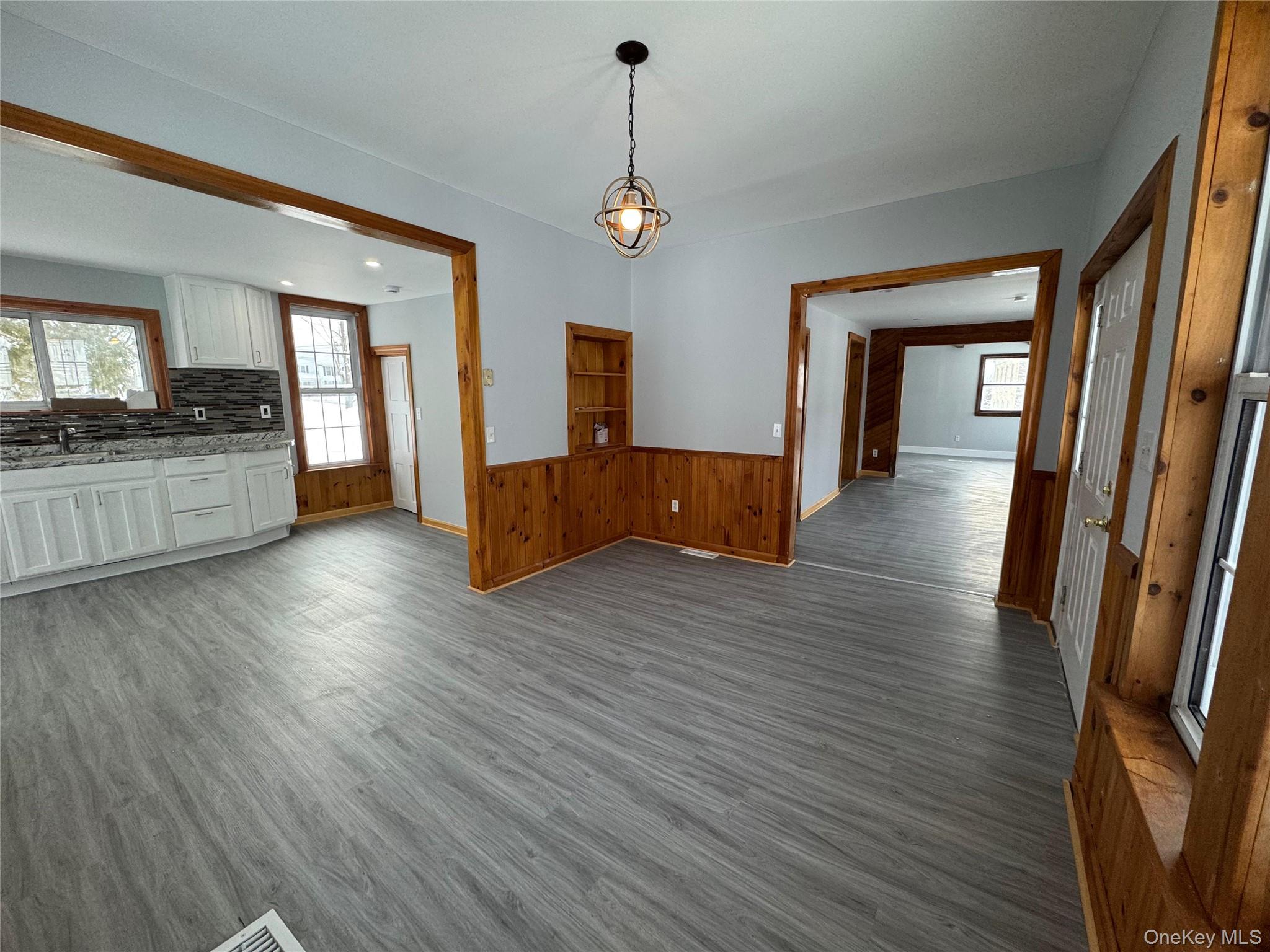 9606 Lincoln Avenue Remsen, NY 13438 - Photo 7 of 47 a view of a hallway with wooden floor and staircase
