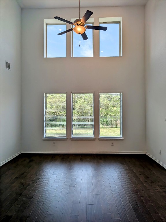 1344 Ridge Runner Drive Georgetown, TX 78628 - Photo 13 of 37 an empty room with wooden floor and windows