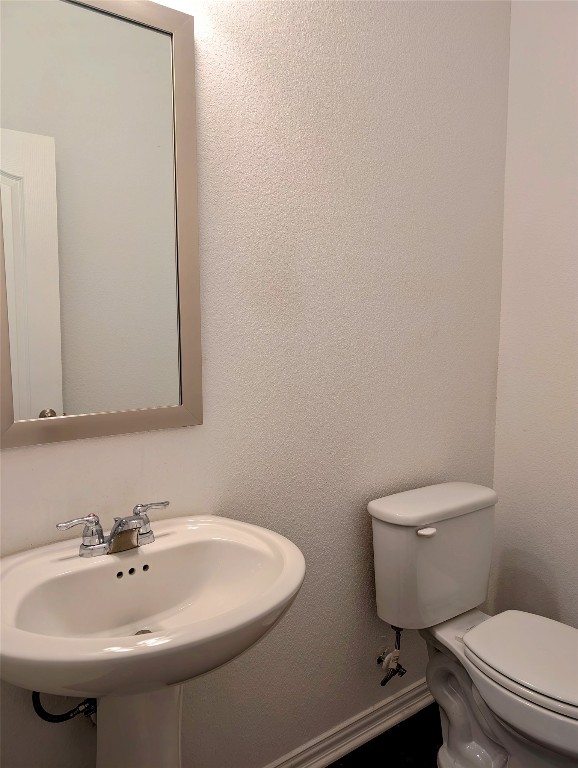 1344 Ridge Runner Drive Georgetown, TX 78628 - Photo 20 of 37 a bathroom with a sink a toilet and mirror