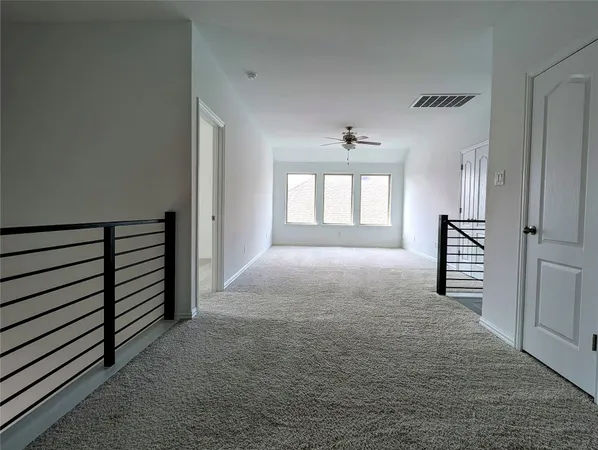 a view of hallway with windows