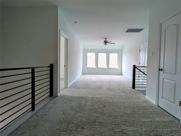 a view of hallway with windows