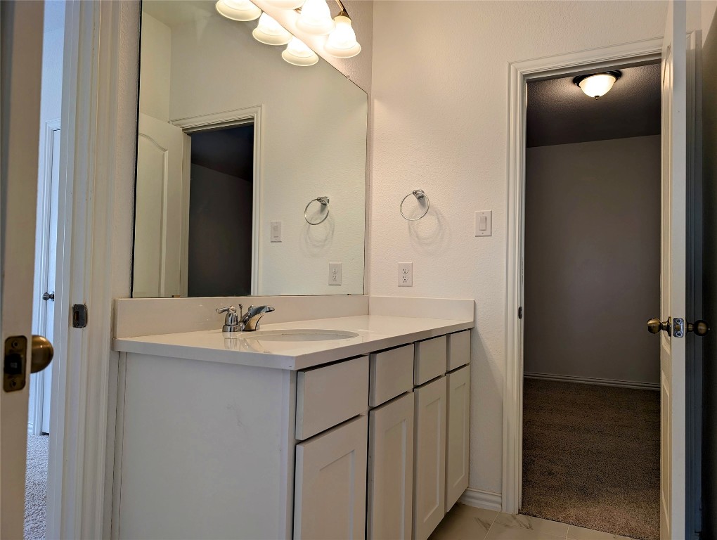1344 Ridge Runner Drive Georgetown, TX 78628 - Photo 29 of 37 a bathroom with a sink and a mirror