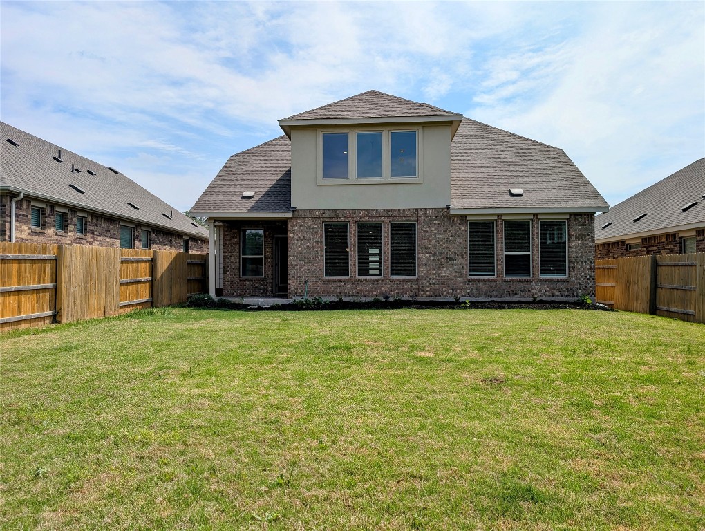 1344 Ridge Runner Drive Georgetown, TX 78628 - Photo 35 of 37 a front view of a house with a garden