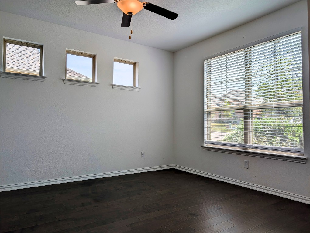 1344 Ridge Runner Drive Georgetown, TX 78628 - Photo 4 of 37 a view of an empty room with wooden floor and a window