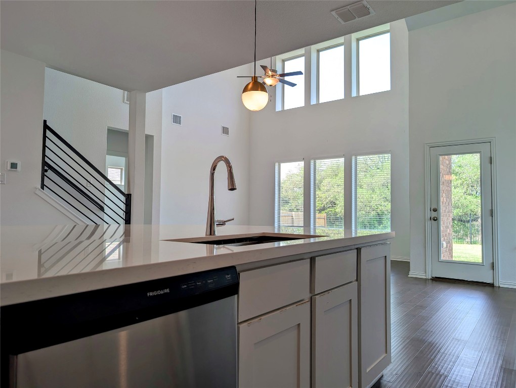 1344 Ridge Runner Drive Georgetown, TX 78628 - Photo 9 of 37 a kitchen with a sink a window and wooden floor