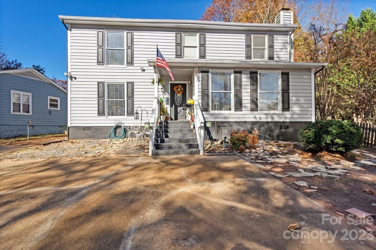 9099 Pitcairn Drive Tega Cay, SC 29708 - Photo 1 of 21 a front view of a house with a yard
