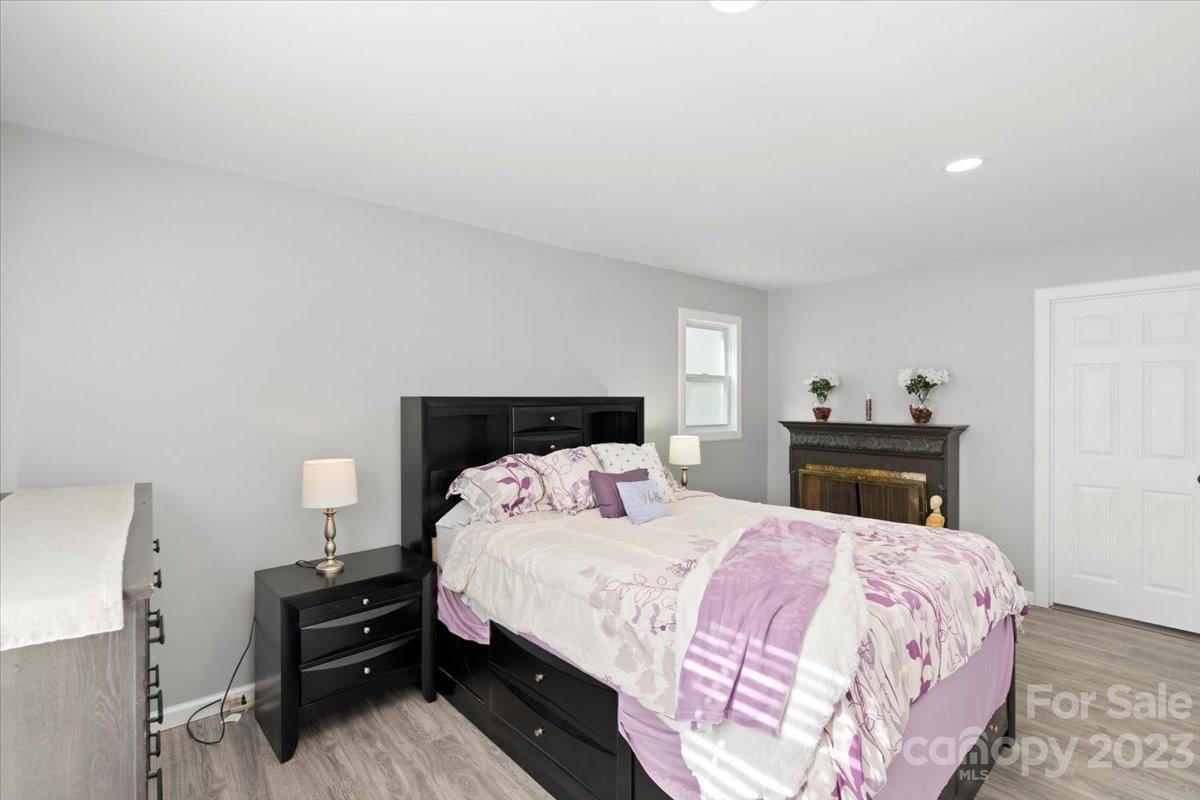 9099 Pitcairn Drive Tega Cay, SC 29708 - Photo 11 of 21 a bedroom with a bed and a dresser