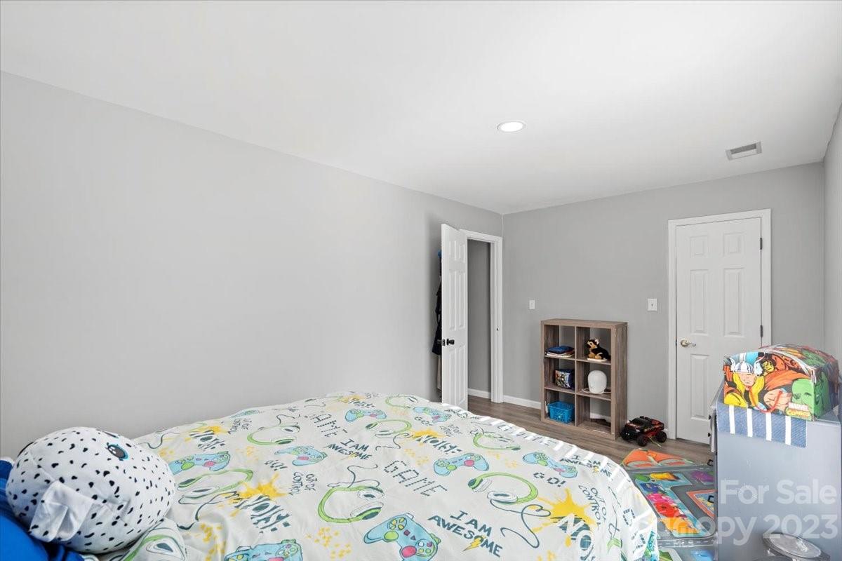 9099 Pitcairn Drive Tega Cay, SC 29708 - Photo 15 of 21 a bedroom with a bed and a closet