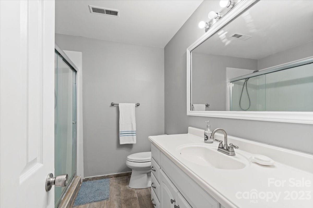 9099 Pitcairn Drive Tega Cay, SC 29708 - Photo 16 of 21 a bathroom with a sink toilet and shower