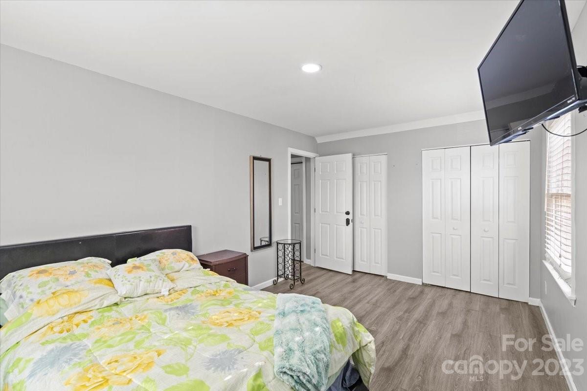 9099 Pitcairn Drive Tega Cay, SC 29708 - Photo 17 of 21 a bedroom with a bed and a window