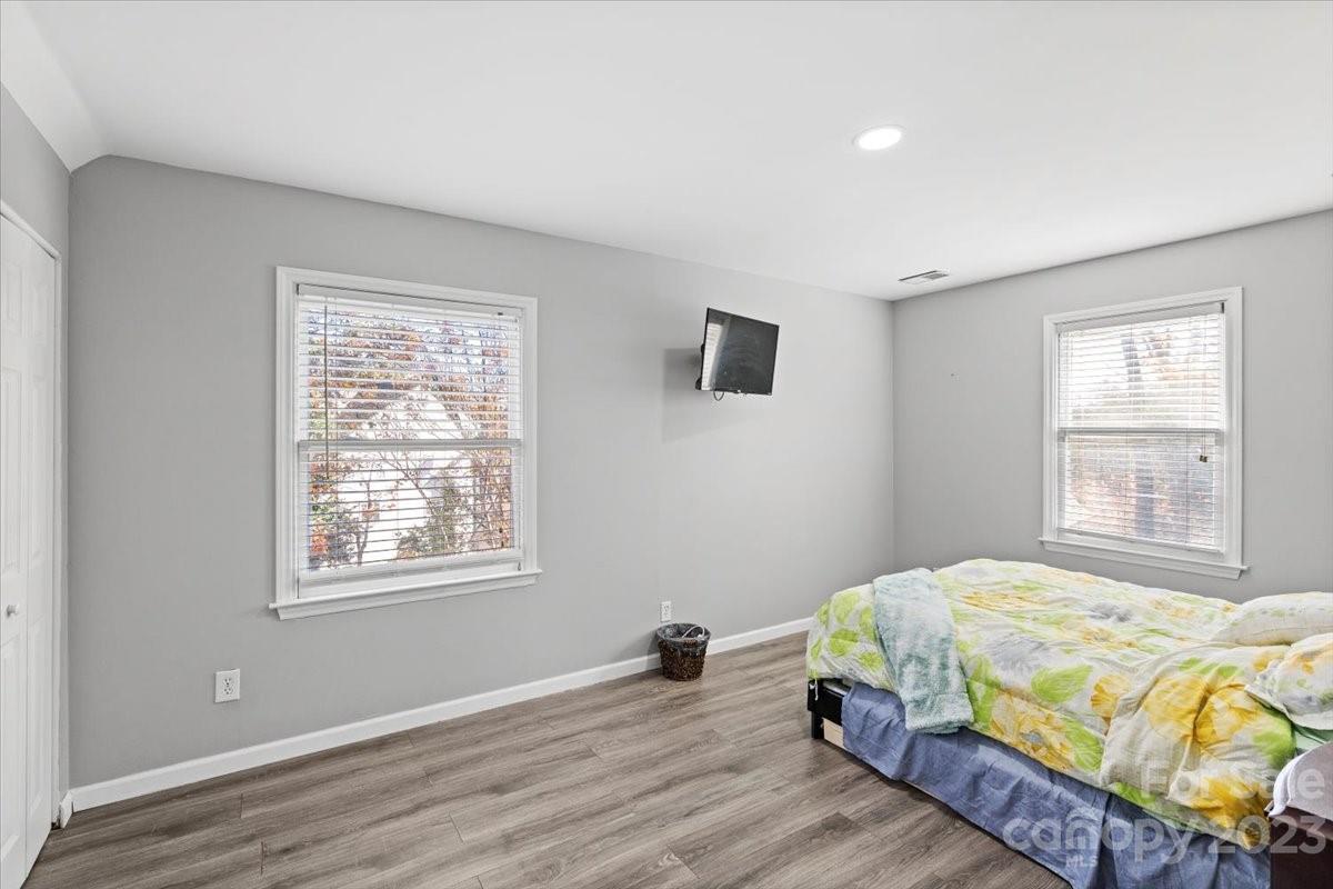 9099 Pitcairn Drive Tega Cay, SC 29708 - Photo 18 of 21 a bedroom with a bed and a window