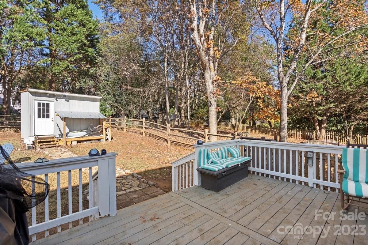 9099 Pitcairn Drive Tega Cay, SC 29708 - Photo 20 of 21 a view of a balcony with wooden floor
