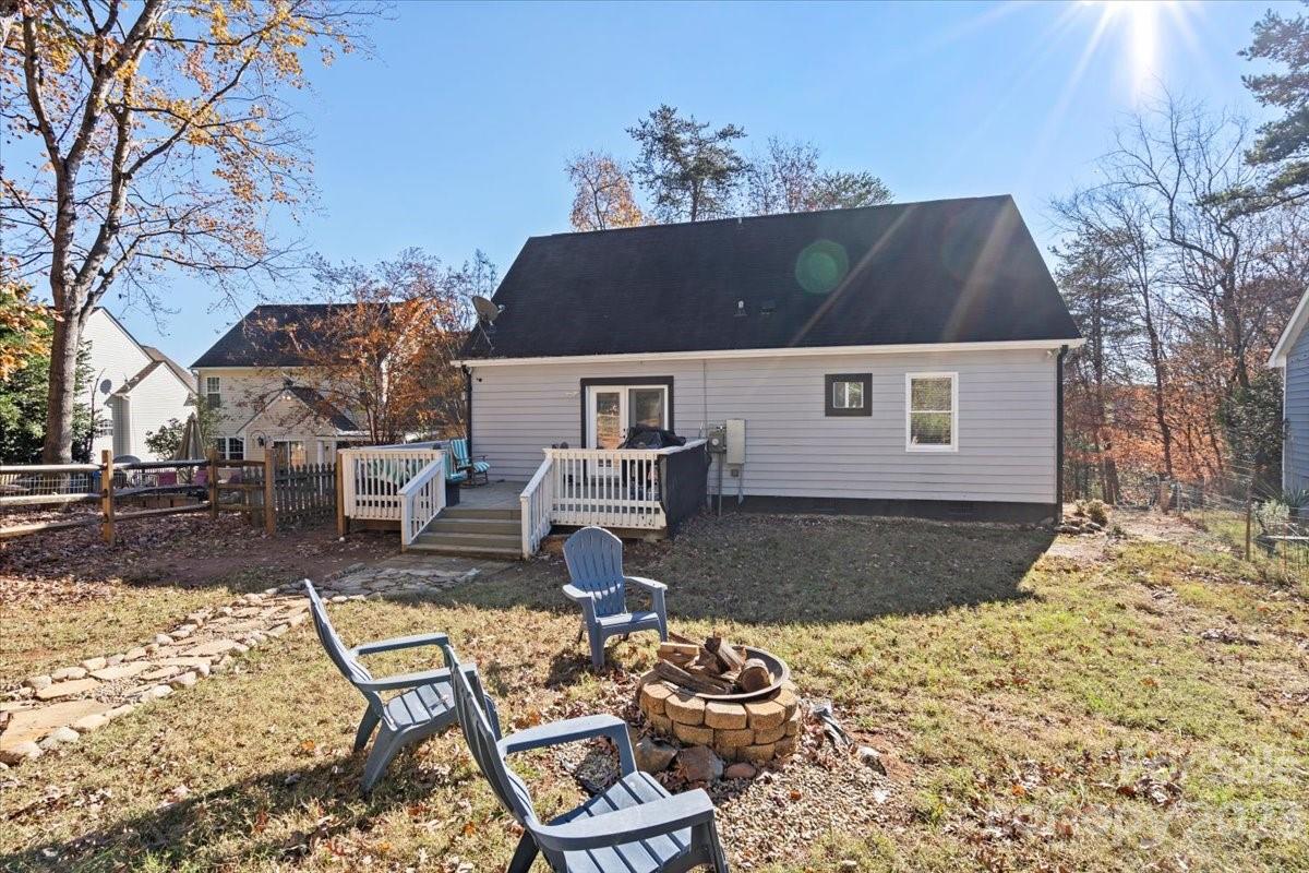 9099 Pitcairn Drive Tega Cay, SC 29708 - Photo 21 of 21 a front view of a house with a yard