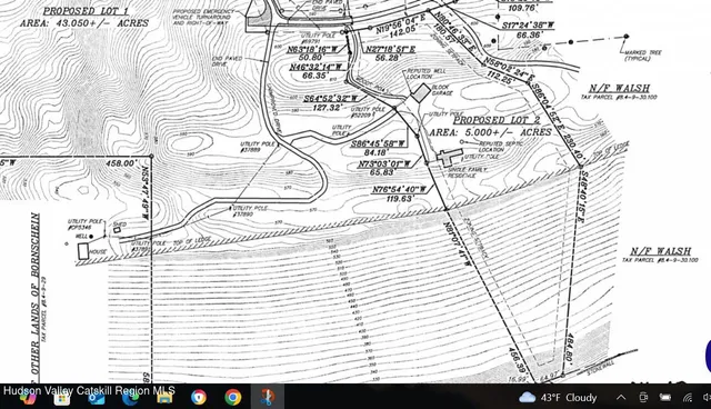 a picture of a bathroom with a shower