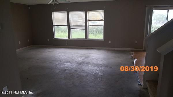 1132 Morning Light Road Jacksonville, FL 32218 - Photo 8 of 19 an empty room with a window