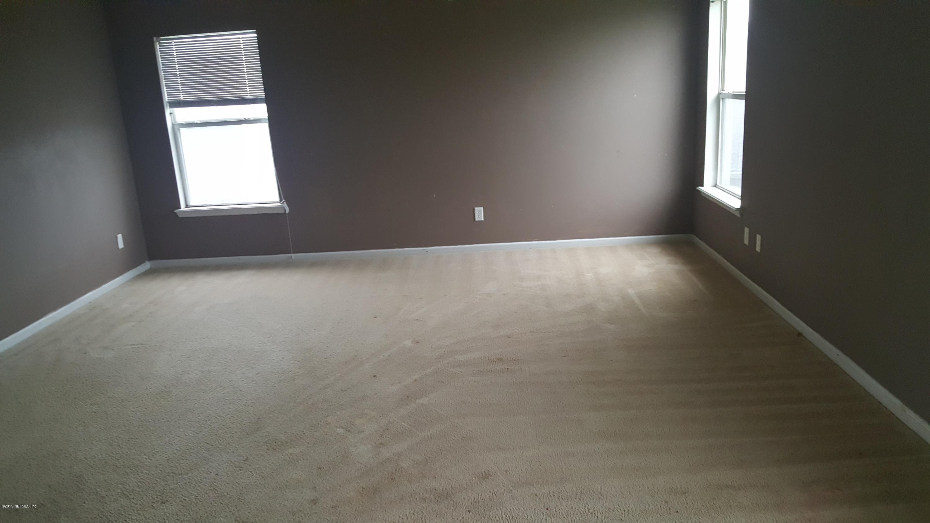 1132 Morning Light Road Jacksonville, FL 32218 - Photo 9 of 19 an empty room that has a window