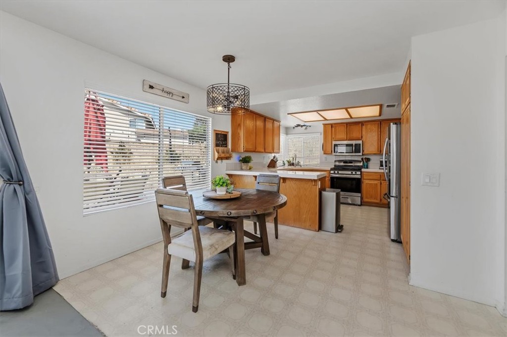 352 Leafwood Court Riverside, CA 92506 - Photo 18 of 42 a view of a dining room with furniture window and outside view