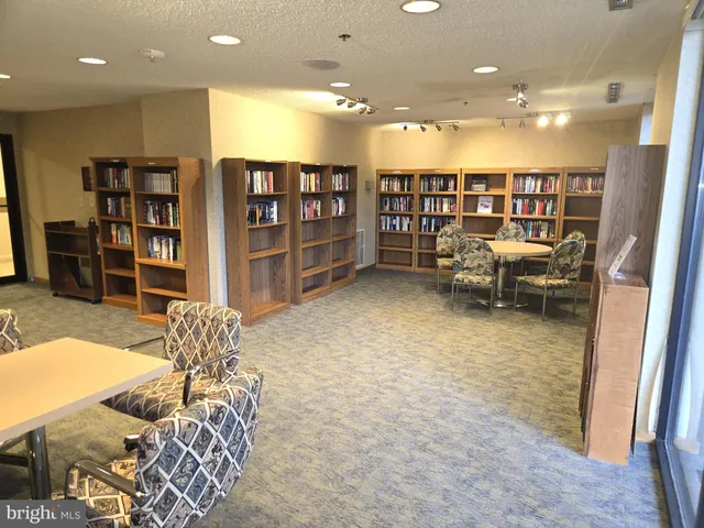 a view of a bathroom with a tub and shower