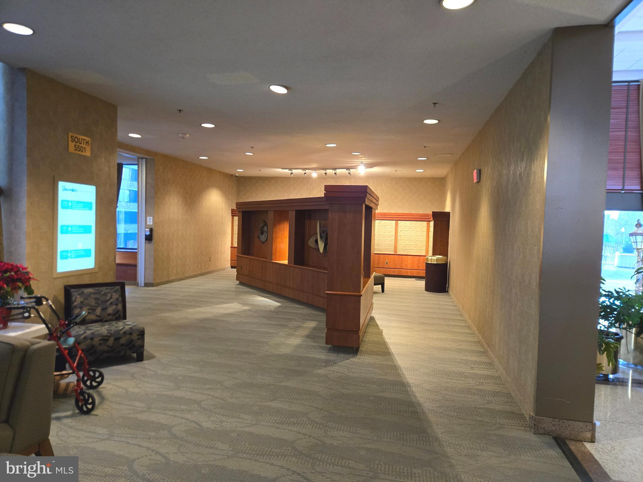 5501 Seminary Road, Unit 214S Falls Church, VA 22041 - Photo 5 of 27 a view of a hallway with couch and a potted plant