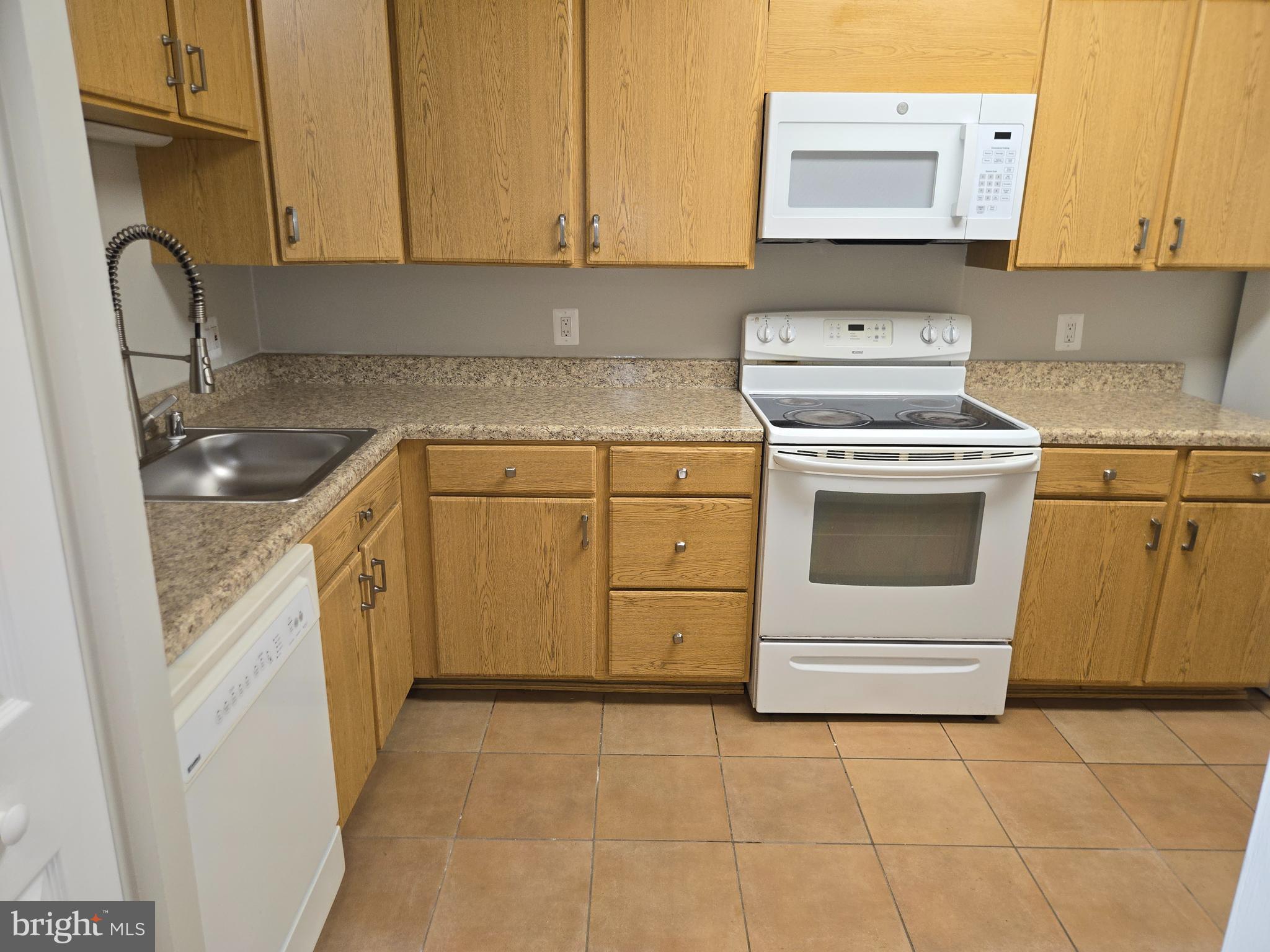 5501 Seminary Road, Unit 214S Falls Church, VA 22041 - Photo 7 of 27 a kitchen with a sink stove and cabinets