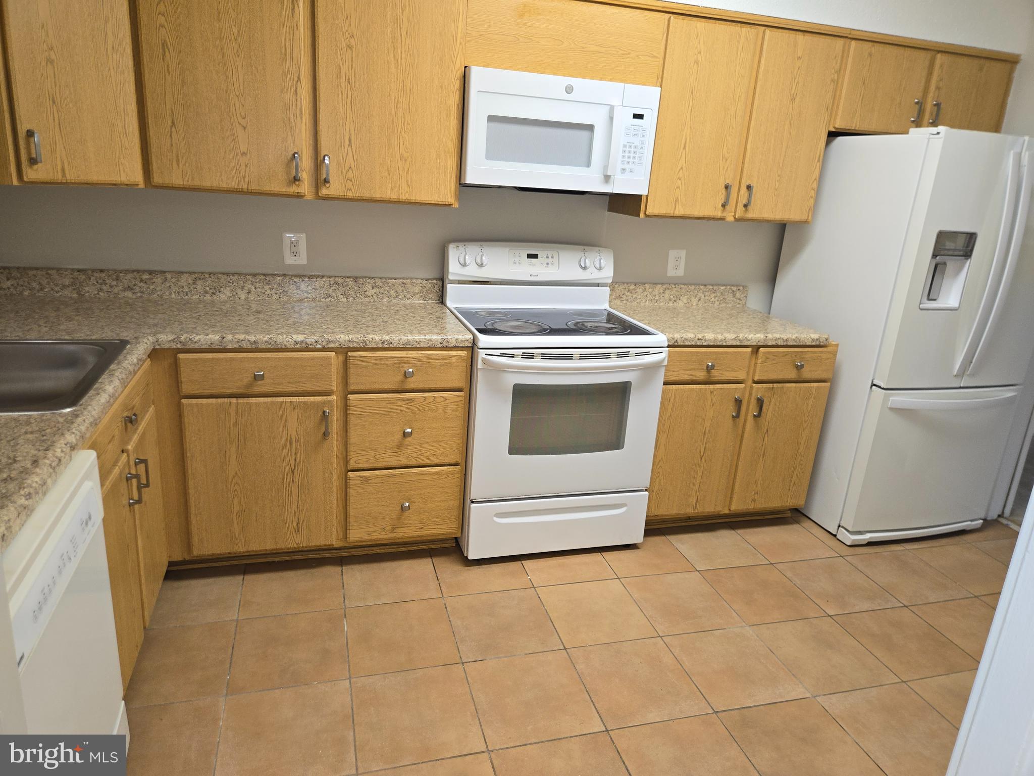 5501 Seminary Road, Unit 214S Falls Church, VA 22041 - Photo 8 of 27 a kitchen with a stove top oven sink and cabinets