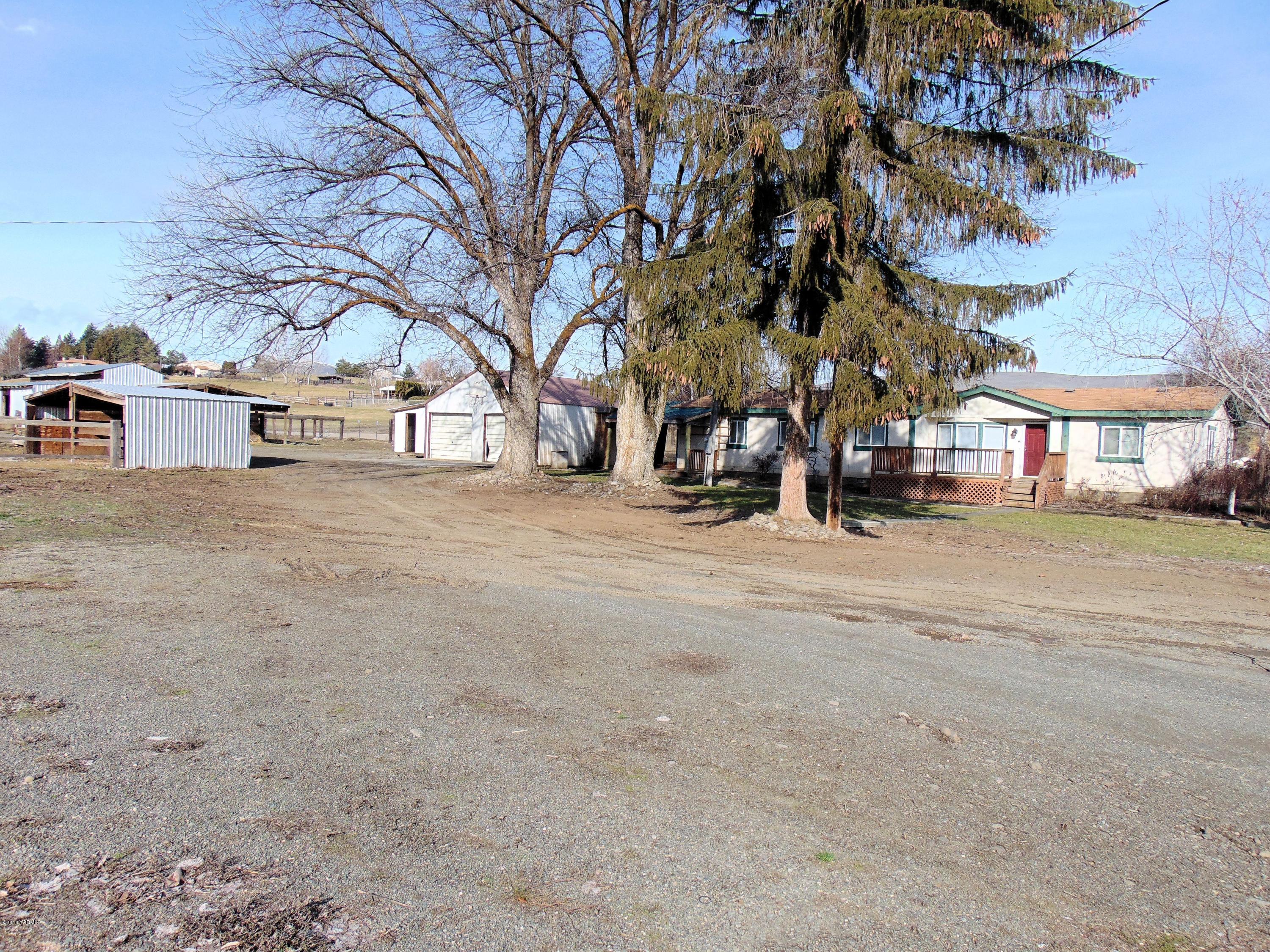 151 Cook Road Yakima, WA 98908 - Photo 3 of 13 a view of road with with a building in the background