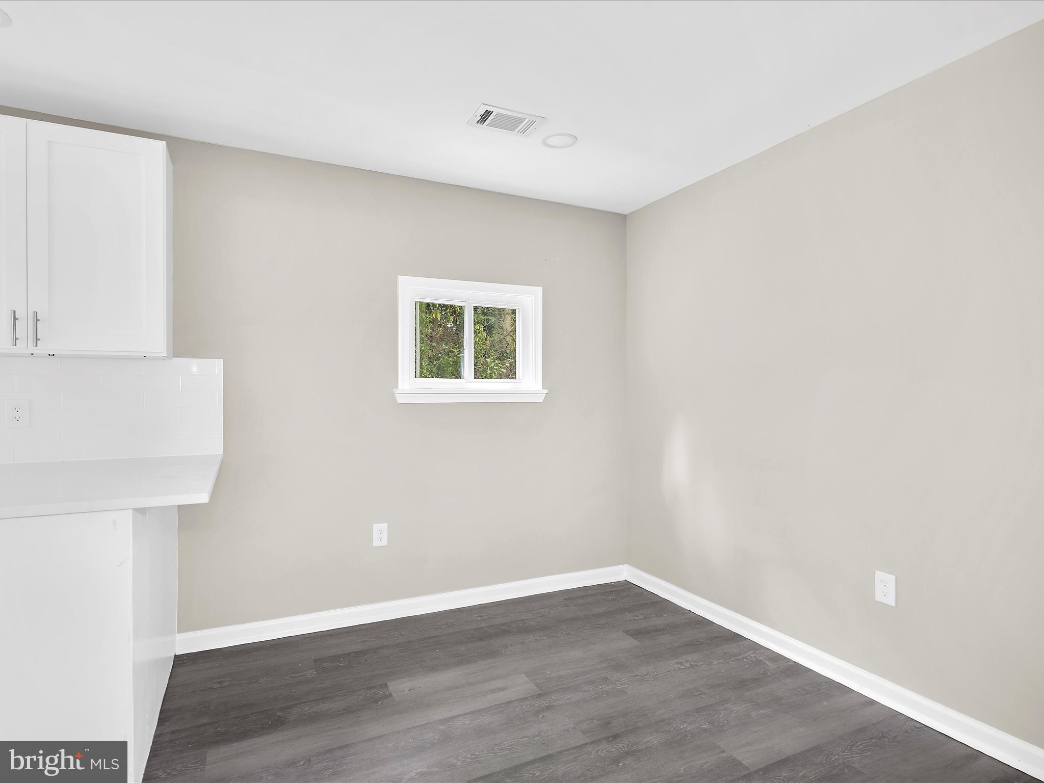 360 Nottingham Road Elkton, MD 21921 - Photo 11 of 32 a view of an empty room with wooden floor and a window