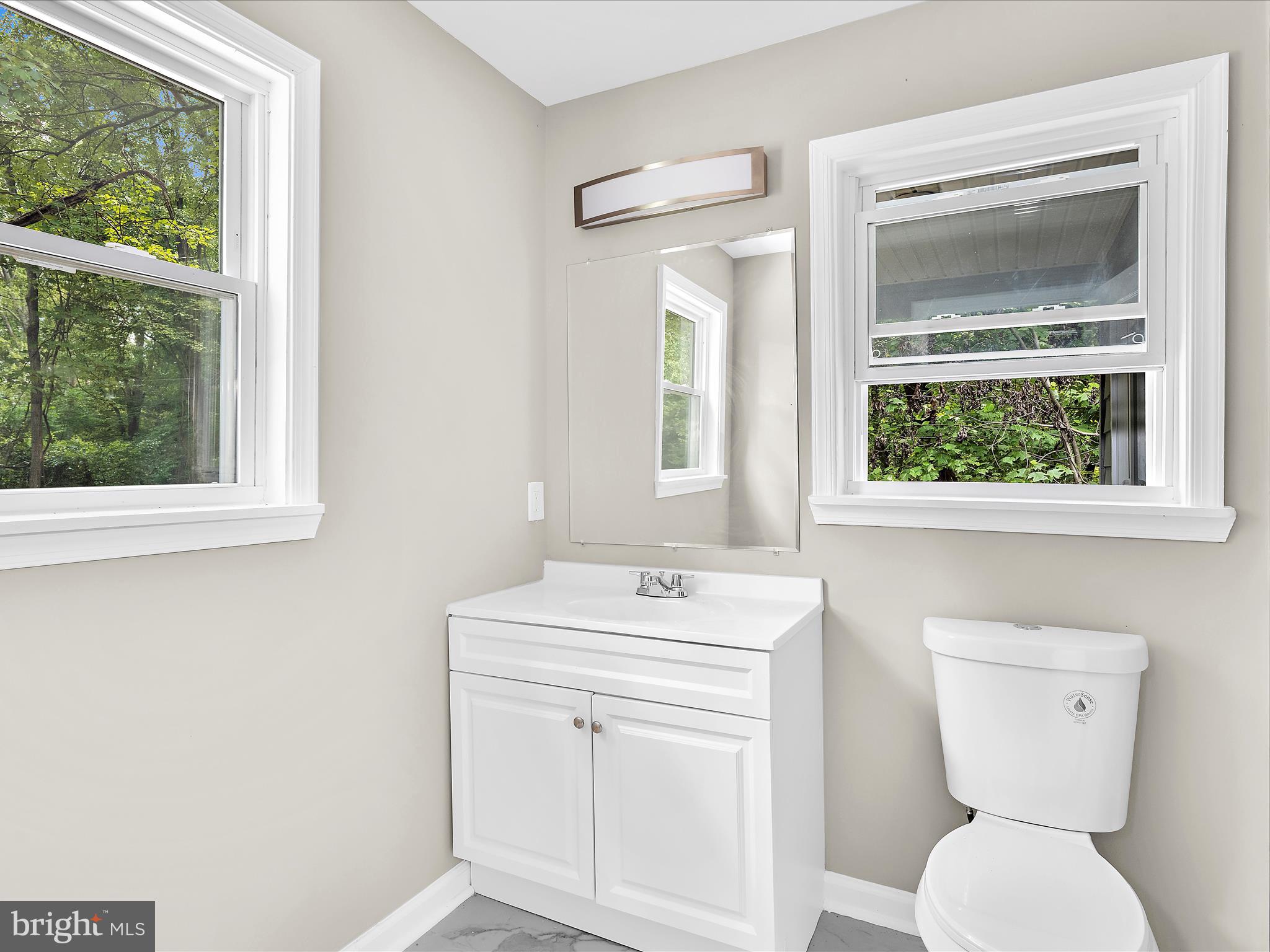 360 Nottingham Road Elkton, MD 21921 - Photo 14 of 32 a bathroom with a toilet sink and mirror
