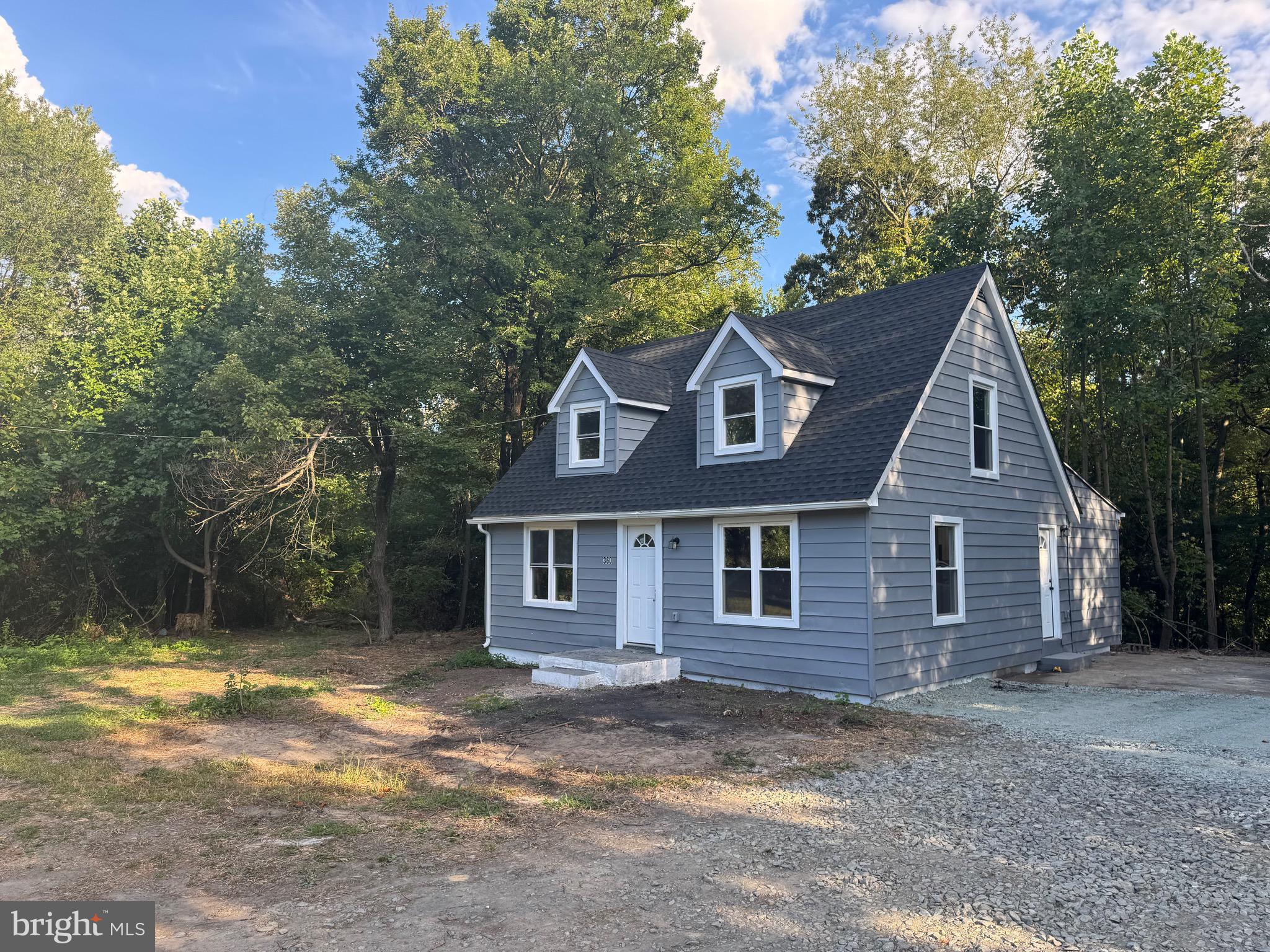360 Nottingham Road Elkton, MD 21921 - Photo 2 of 32 a view of a yard in front of a house with large trees