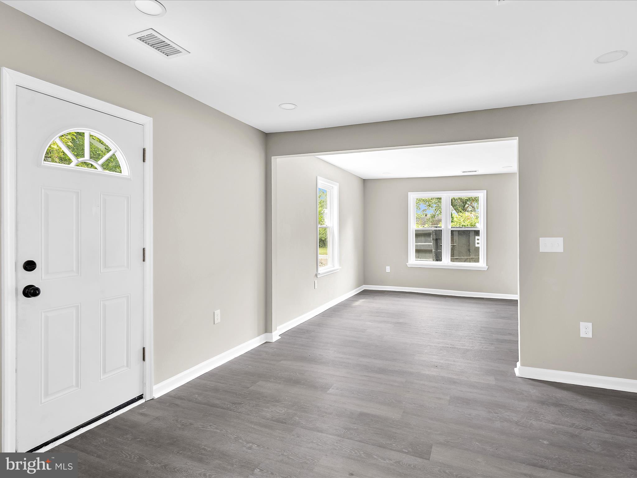 360 Nottingham Road Elkton, MD 21921 - Photo 3 of 32 an empty room with a window and wooden floor