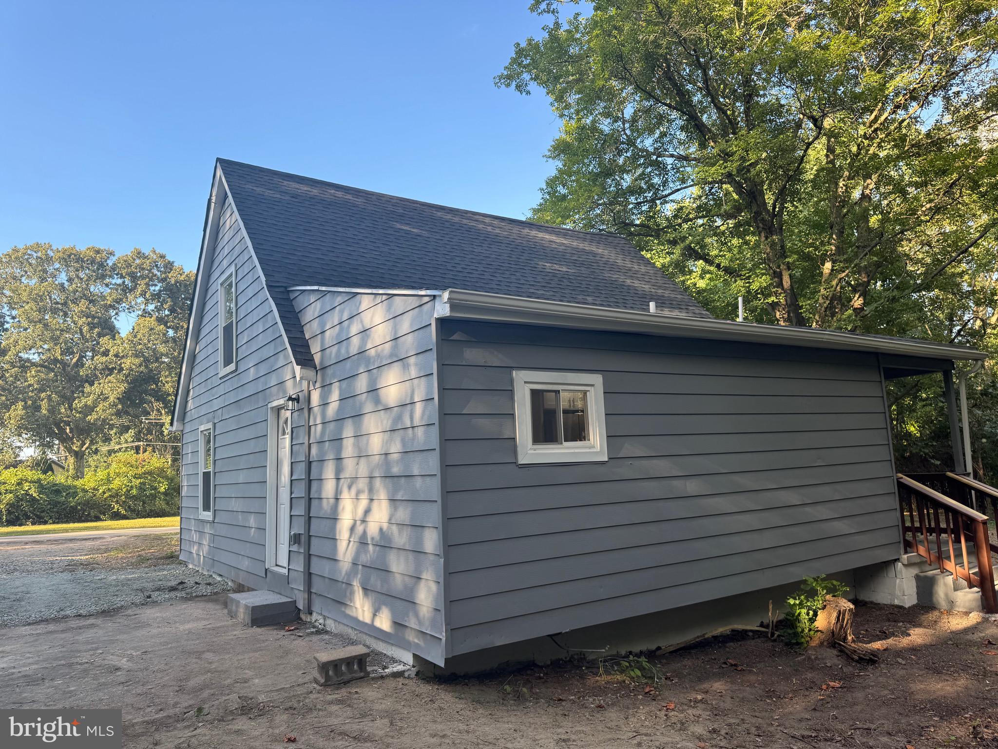 360 Nottingham Road Elkton, MD 21921 - Photo 31 of 32 a view of a small house with a yard and wooden fence