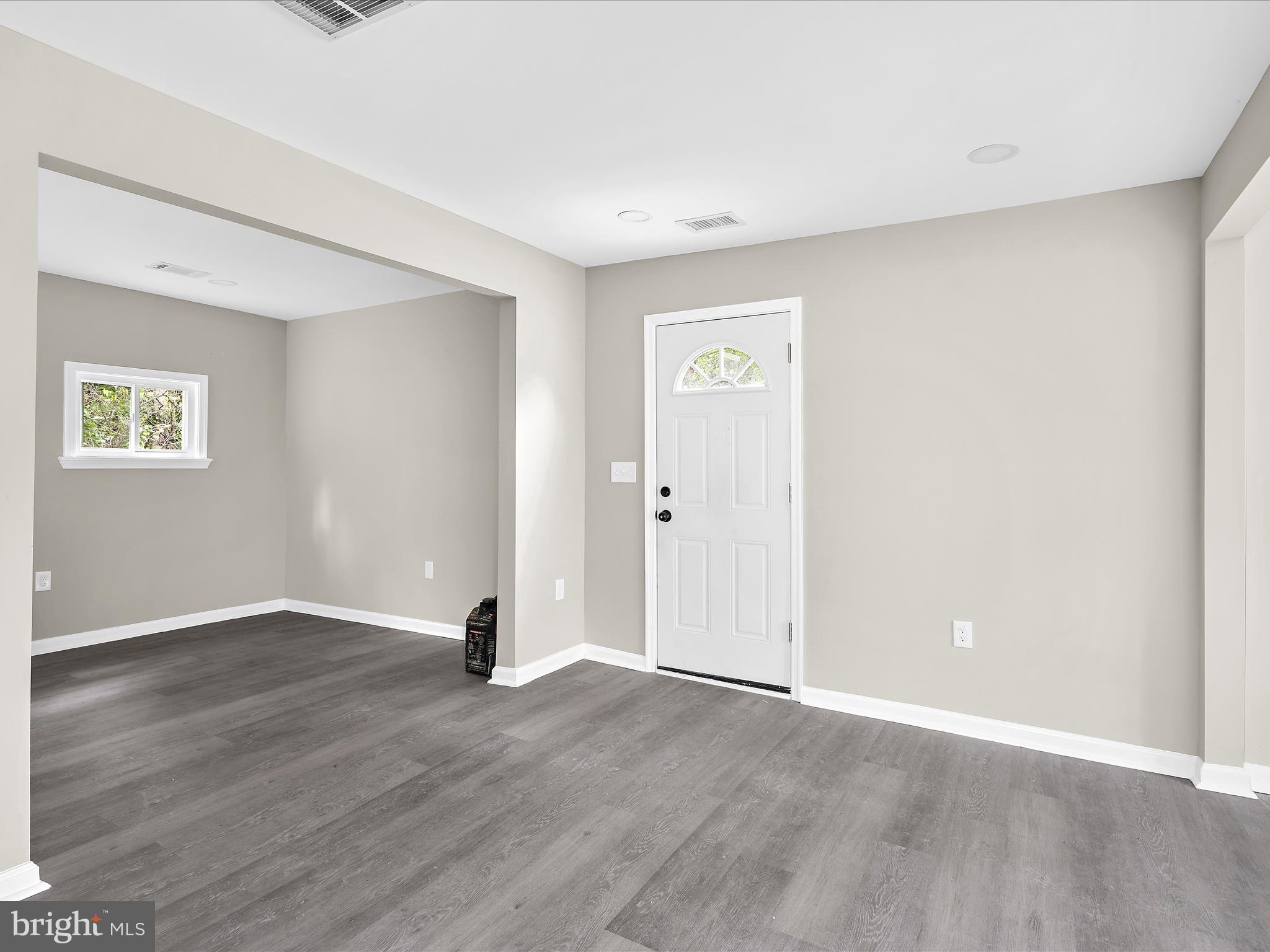 360 Nottingham Road Elkton, MD 21921 - Photo 4 of 32 an empty room with wooden floor and windows