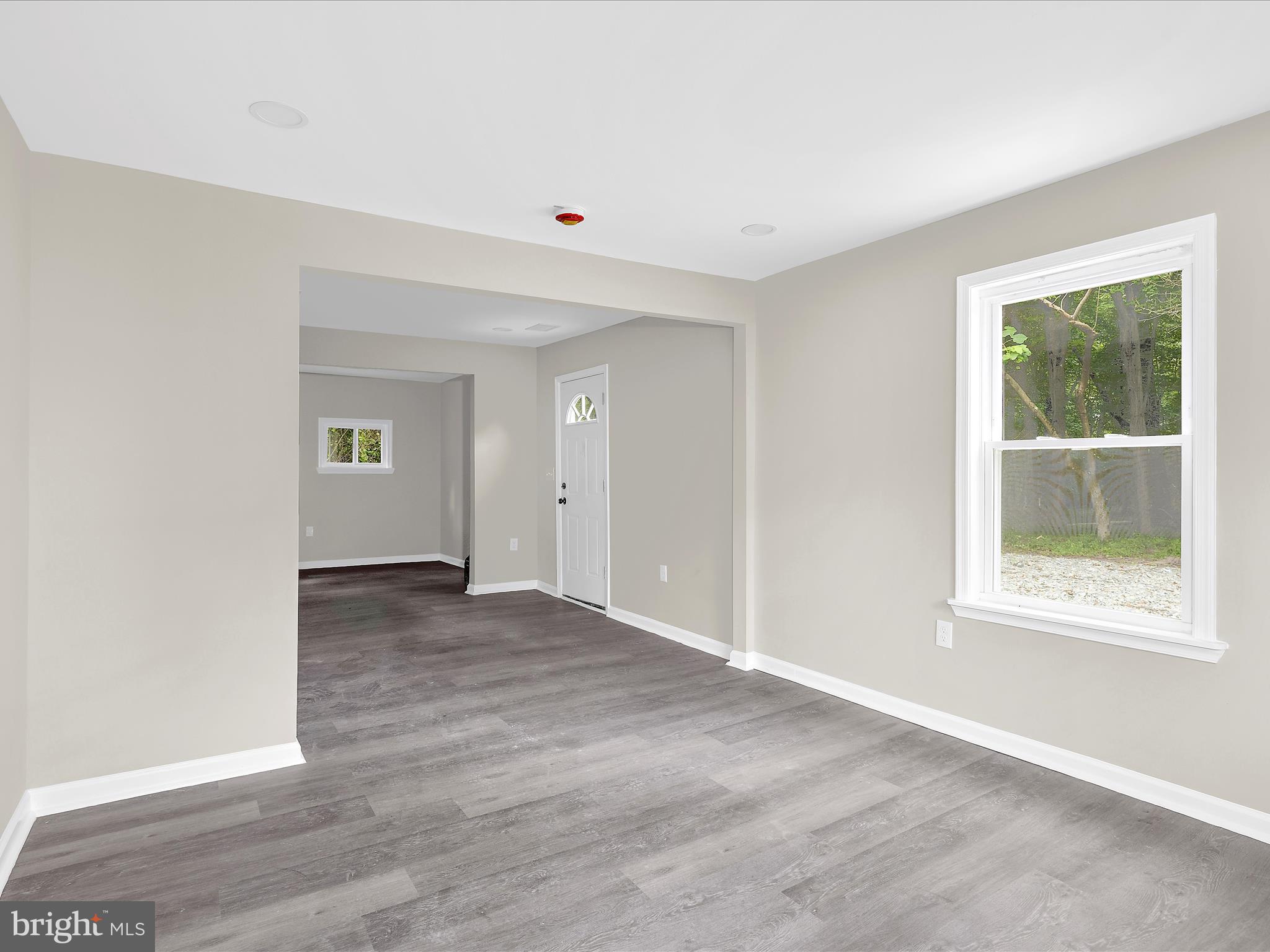 360 Nottingham Road Elkton, MD 21921 - Photo 5 of 32 an empty room with wooden floor and windows