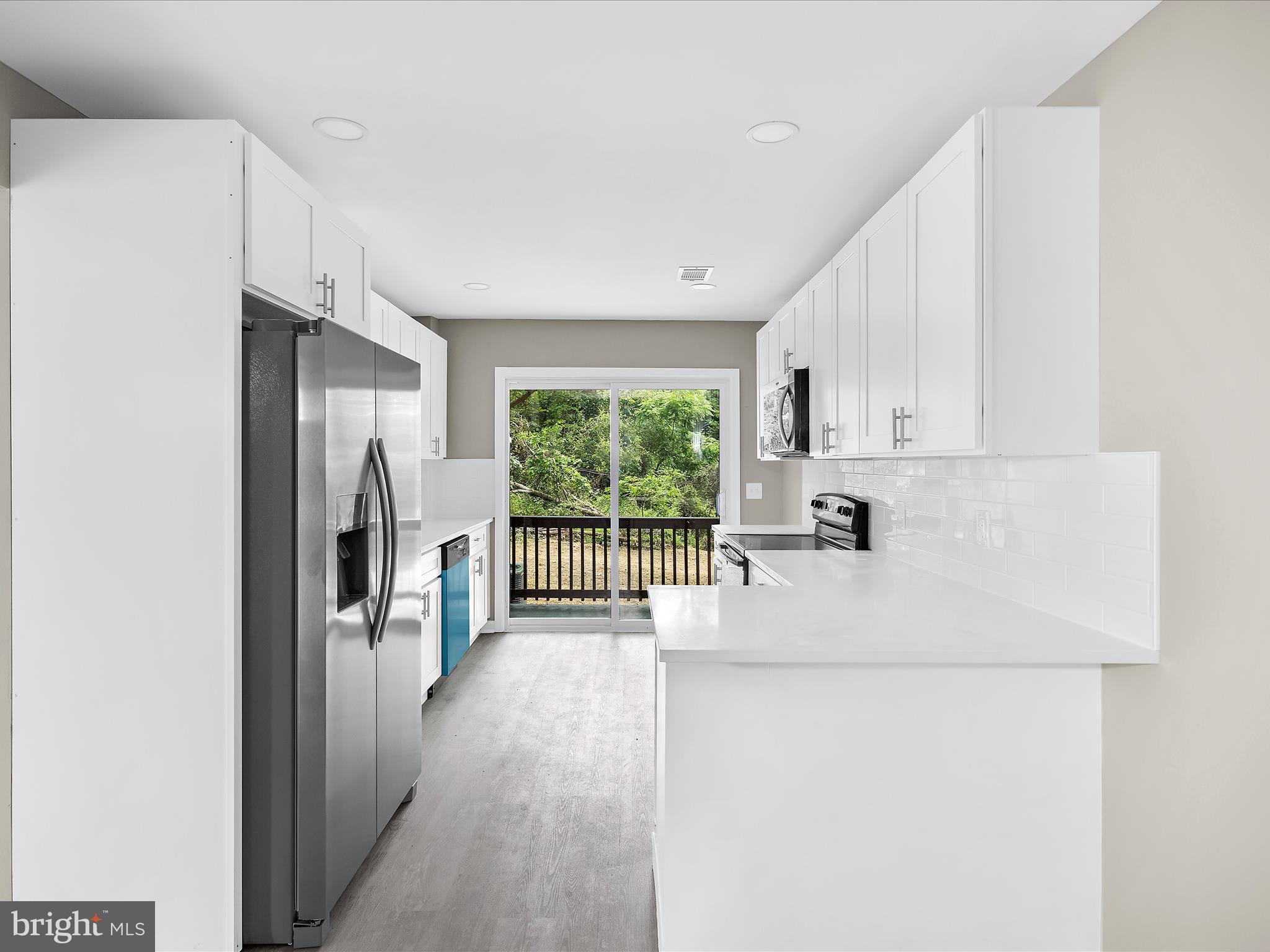 360 Nottingham Road Elkton, MD 21921 - Photo 6 of 32 a view of a kitchen with a refrigerator a sink a refrigerator and a window