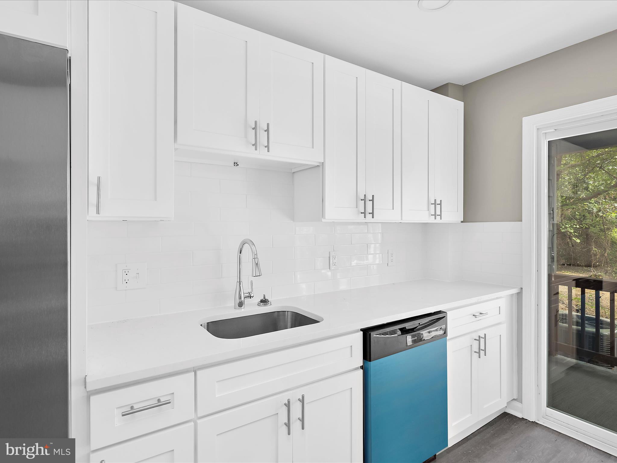 360 Nottingham Road Elkton, MD 21921 - Photo 7 of 32 a kitchen with white cabinets and white appliances