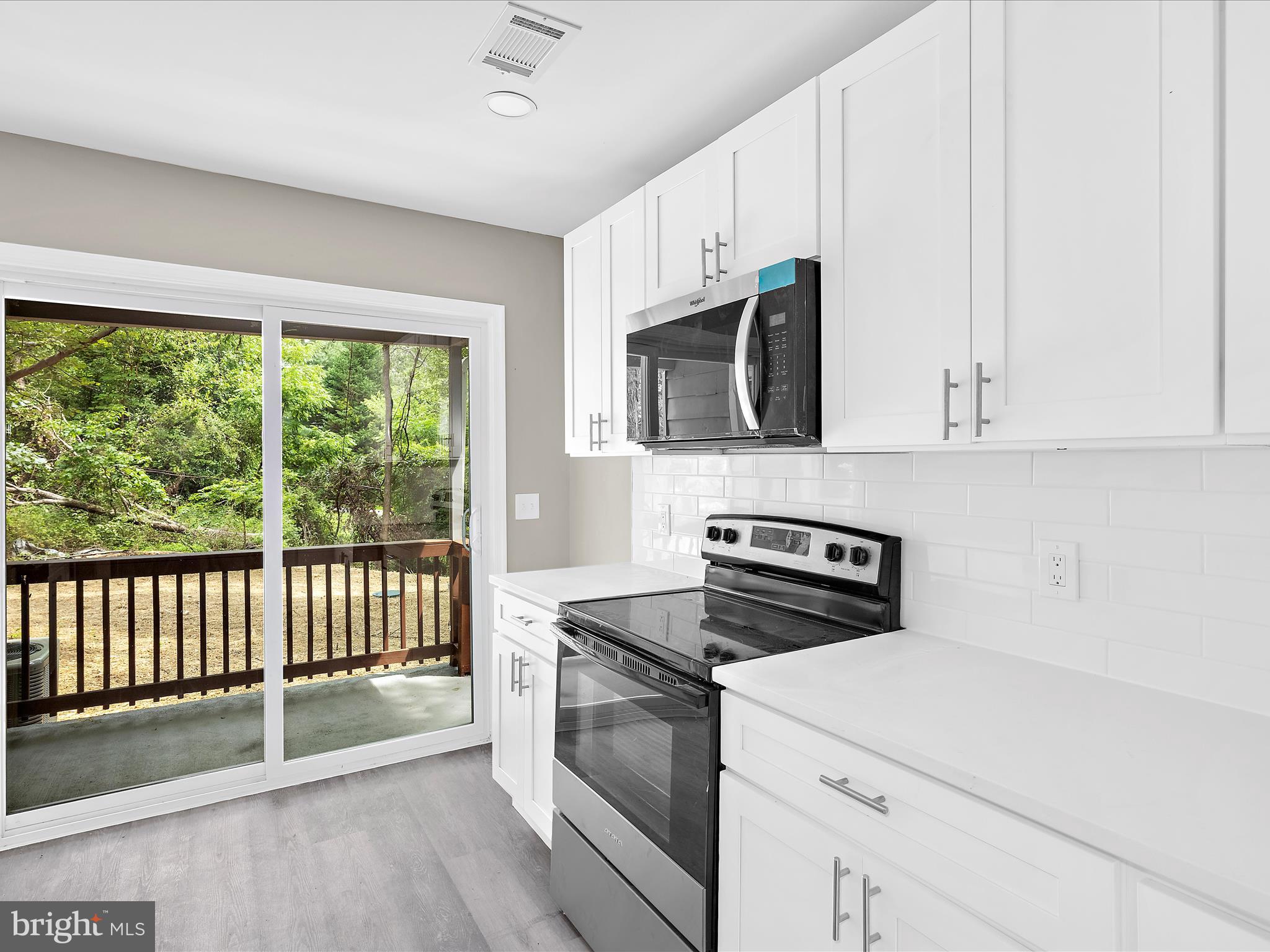 360 Nottingham Road Elkton, MD 21921 - Photo 8 of 32 a kitchen with stainless steel appliances white cabinets and a stove top oven