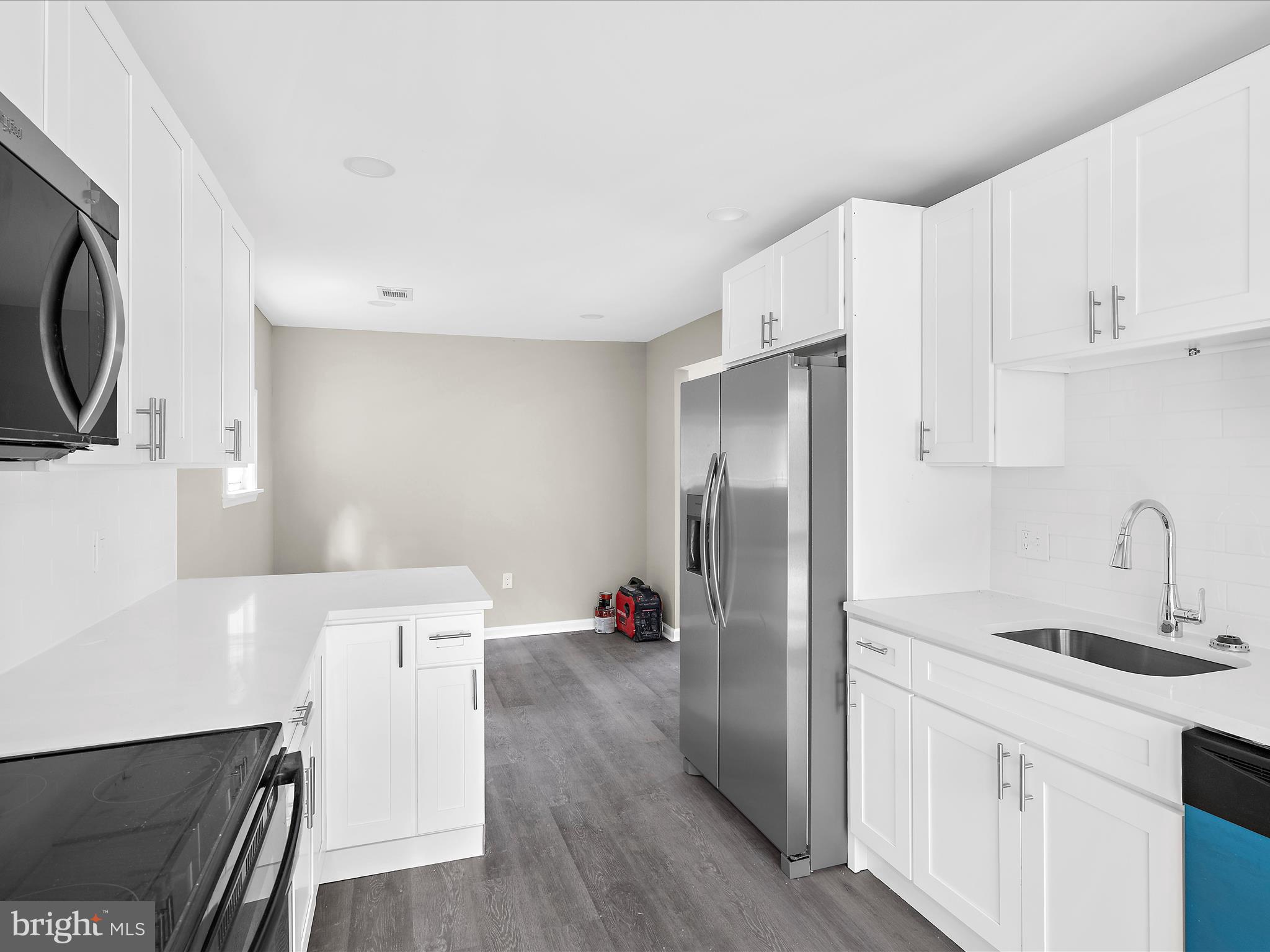 360 Nottingham Road Elkton, MD 21921 - Photo 9 of 32 a kitchen with stainless steel appliances a refrigerator sink and white cabinets