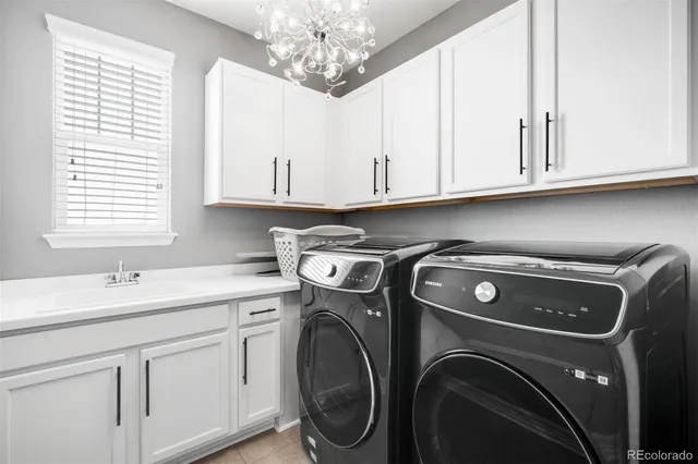 a utility room with closet dryer and washer