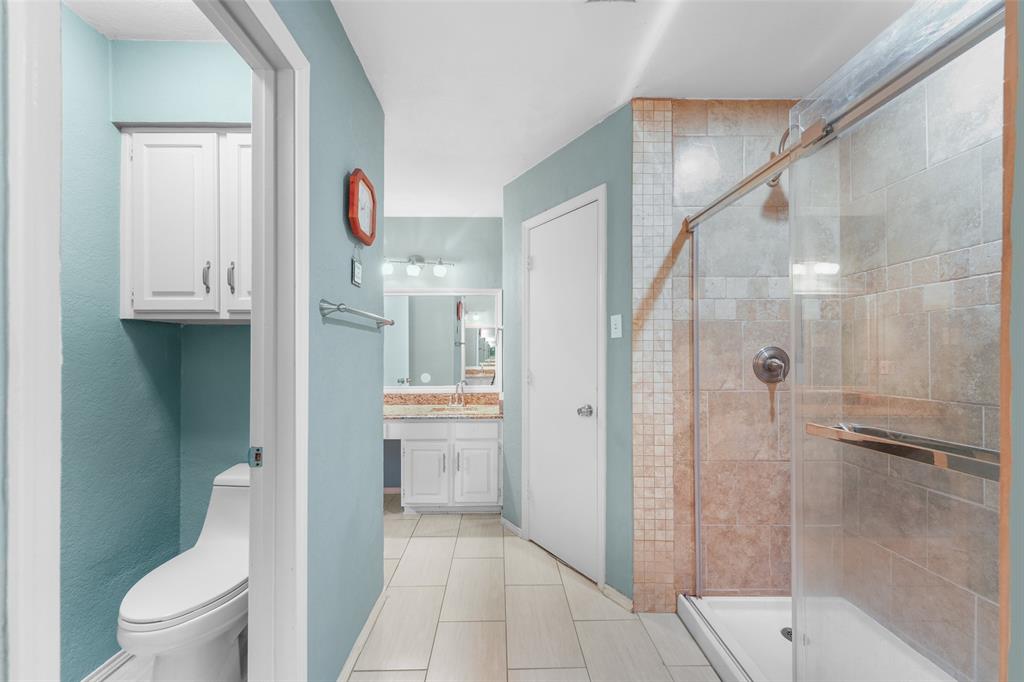 2127 Holt Road Arlington, TX 76006 - Photo 13 of 18 a bathroom with a shower and a toilet