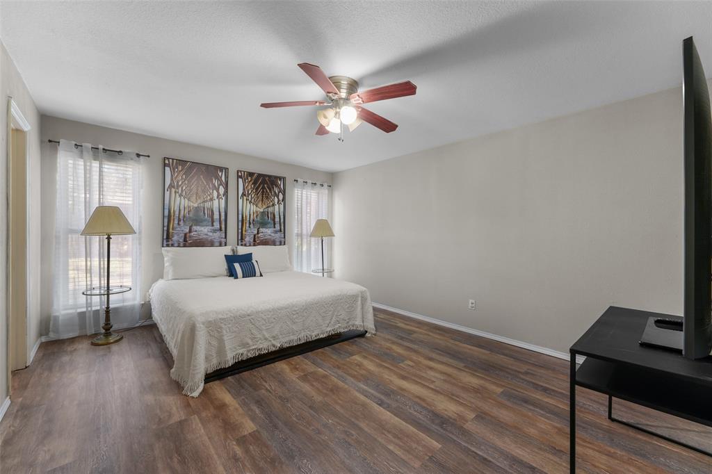 2127 Holt Road Arlington, TX 76006 - Photo 16 of 18 a bedroom with a bed window and a table
