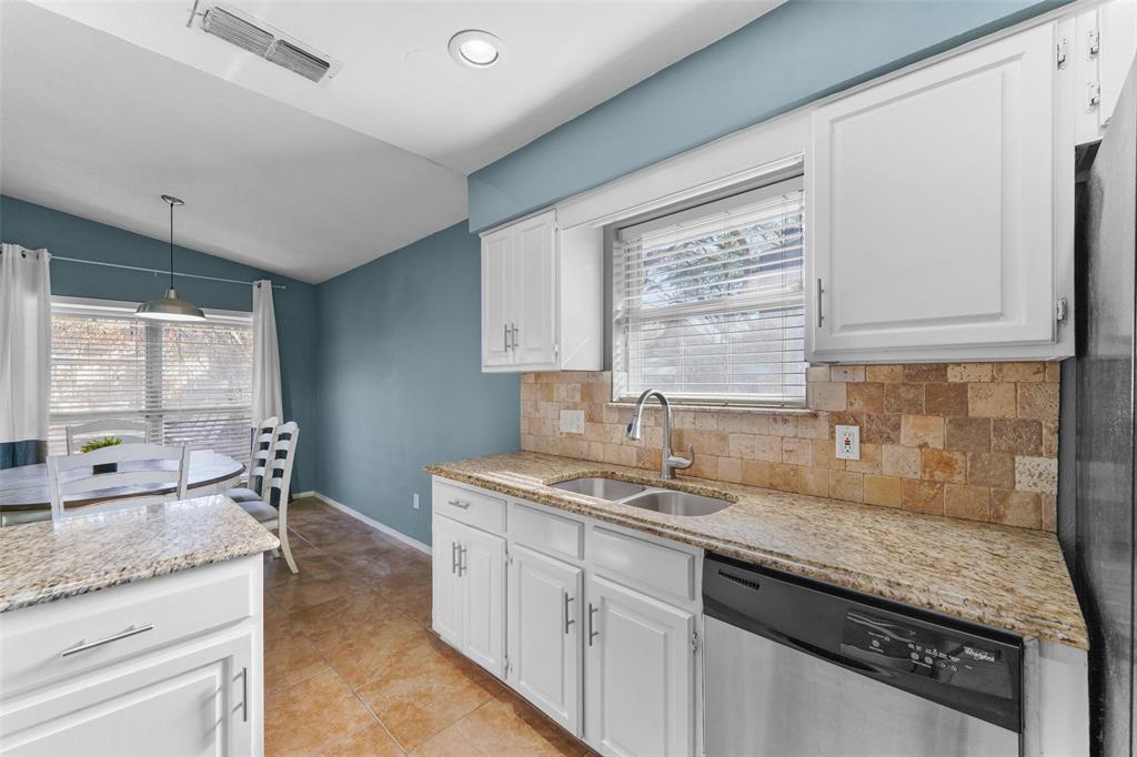 2127 Holt Road Arlington, TX 76006 - Photo 8 of 18 a kitchen with granite countertop a sink and a window