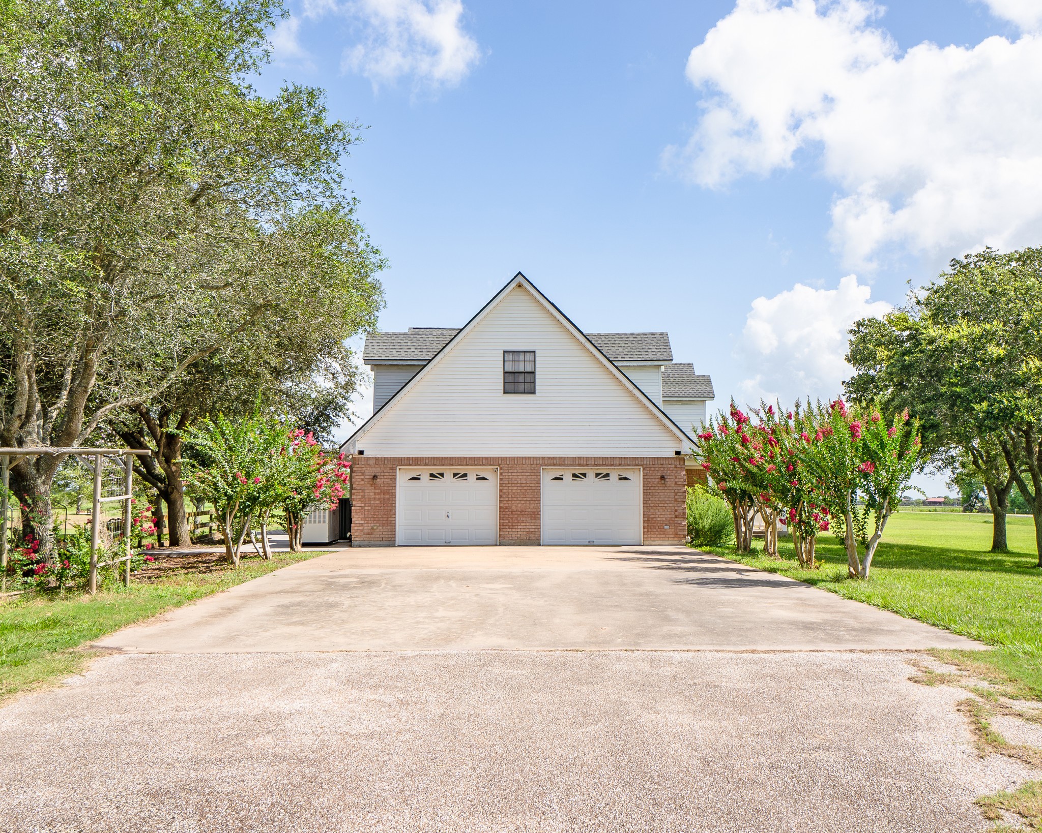 214 Williams Road Bay City, TX 77414 - Photo 5 of 48 a front view of a house with a garden and trees