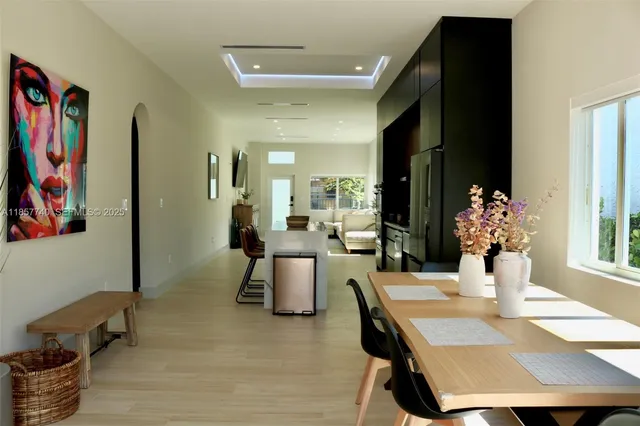 a dining room with furniture and wooden floor