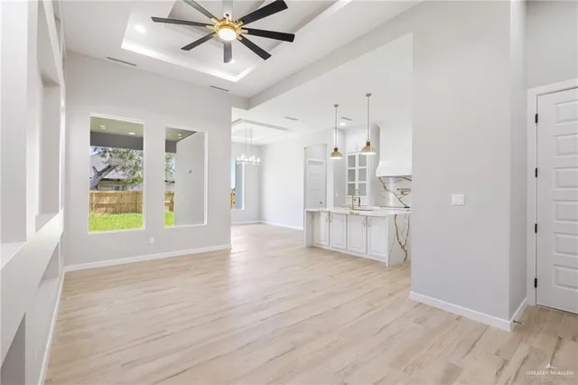 a view of a livingroom with a kitchen