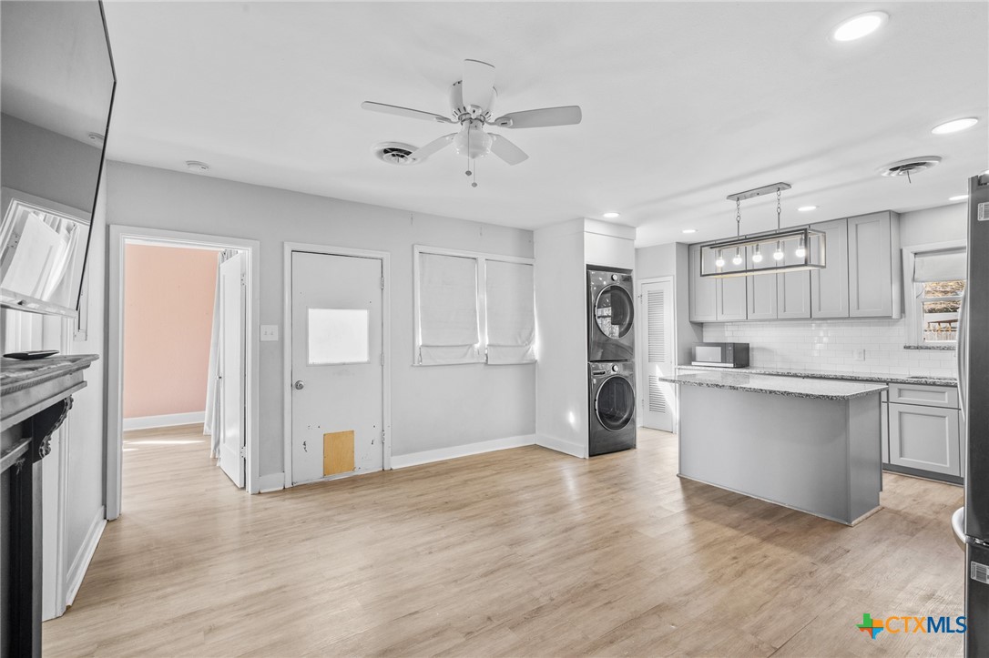 3109 North Main Street Victoria, TX 77901 - Photo 13 of 29 a view of a kitchen with a sink and a refrigerator