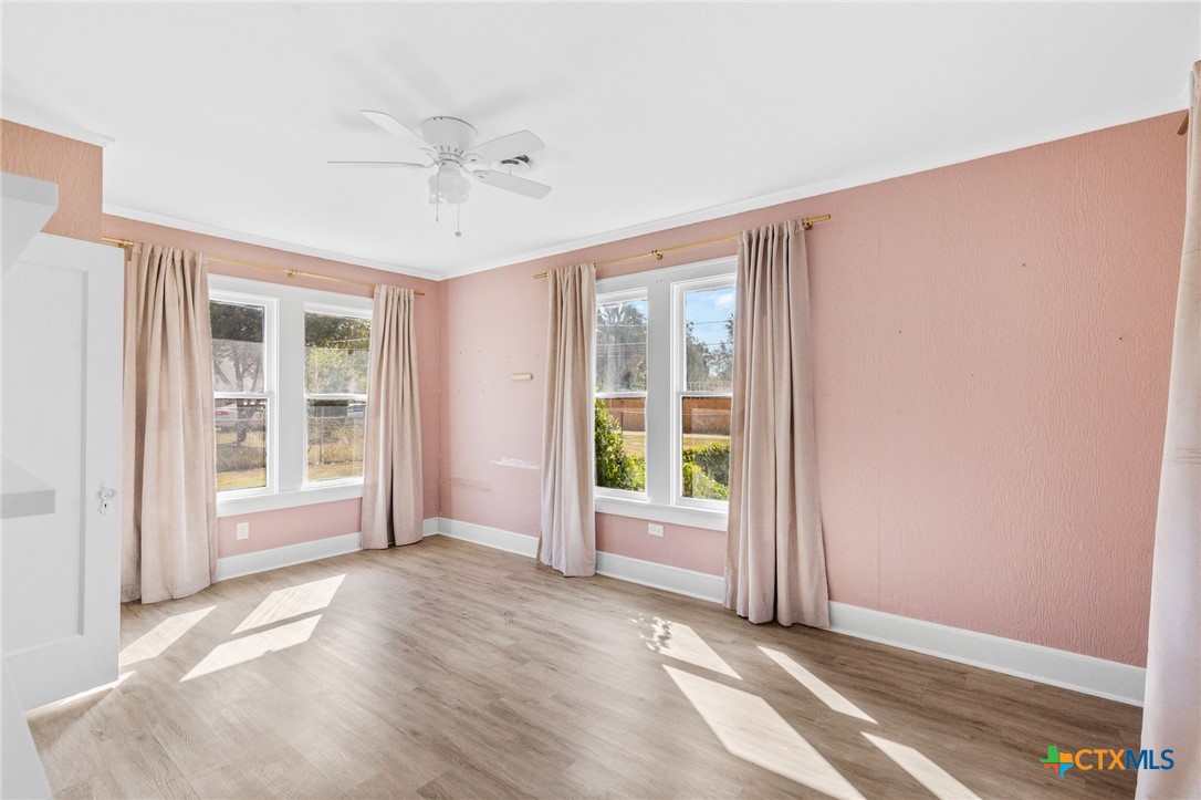 3109 North Main Street Victoria, TX 77901 - Photo 14 of 29 an empty room with windows and closet