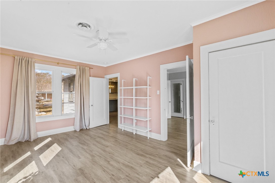 3109 North Main Street Victoria, TX 77901 - Photo 15 of 29 a view of empty room with wooden floor and closet