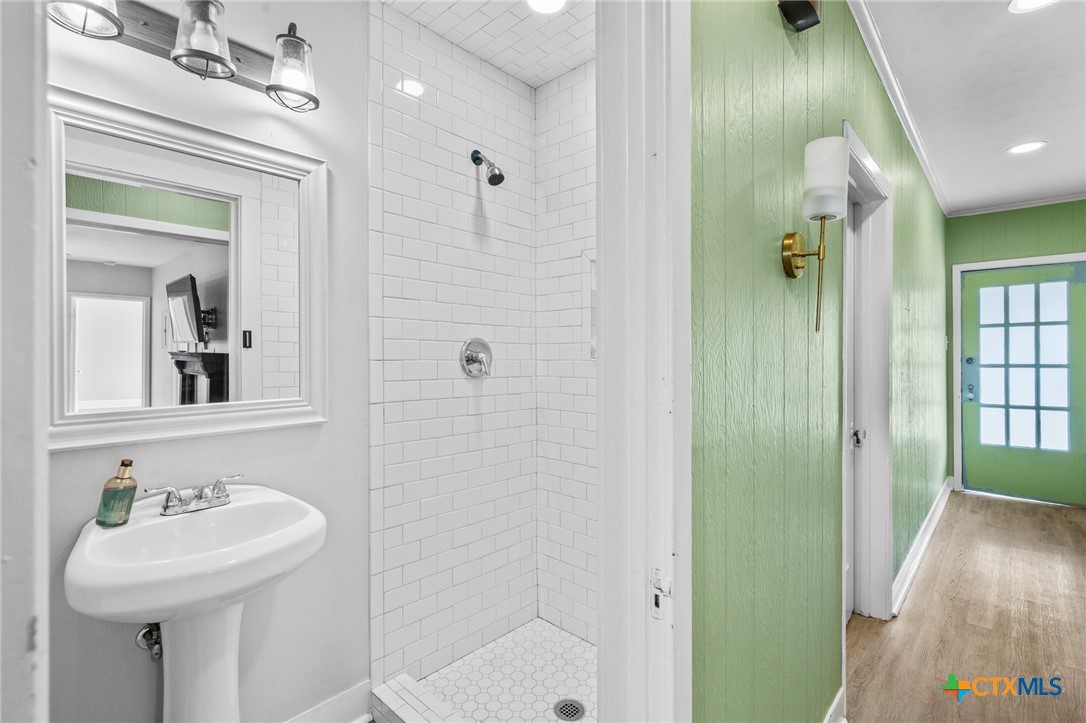3109 North Main Street Victoria, TX 77901 - Photo 16 of 29 a bathroom with a sink a toilet and shower