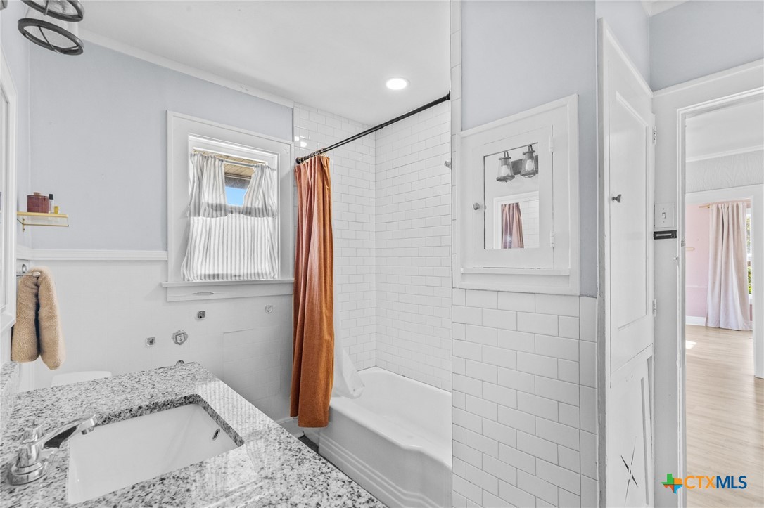 3109 North Main Street Victoria, TX 77901 - Photo 17 of 29 a bathroom with a sink and a shower