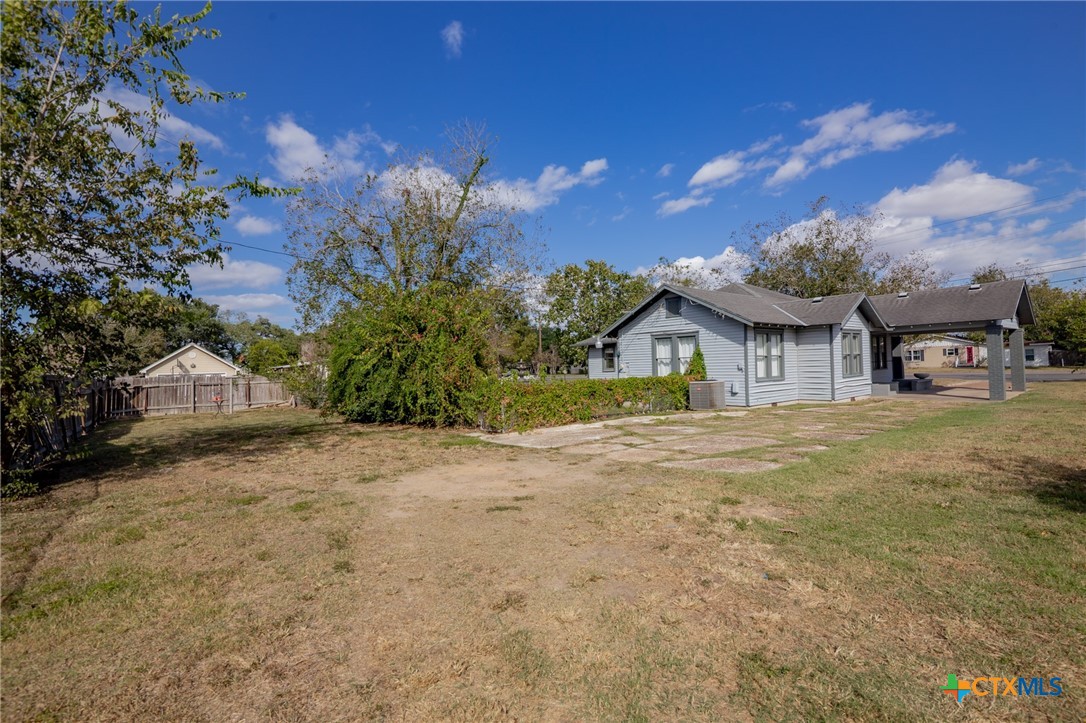 3109 North Main Street Victoria, TX 77901 - Photo 23 of 29 a view of a house with a yard and garage